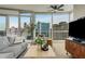 Contemporary living room with a ceiling fan, modern furniture, and hardwood floors at 3325 Piedmont Ne Rd # 1907, Atlanta, GA 30305