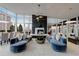 Upscale lounge area with cozy seating, fireplace, and scenic city views provides a luxurious residential experience at 3325 Piedmont Ne Rd # 1907, Atlanta, GA 30305