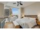 Cozy main bedroom featuring a large window with city skyline view, and light, modern furnishings at 3325 Piedmont Ne Rd # 1907, Atlanta, GA 30305