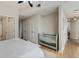 Cozy main bedroom featuring wood floors, a walk in shower, and a crib at 3325 Piedmont Ne Rd # 1907, Atlanta, GA 30305