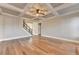 Spacious living room featuring coffered ceilings and staircase access at 4032 Copper Creek Way, Buford, GA 30519