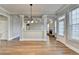 Bright and airy living room with hardwood floors, coffered ceilings, and open layout at 4032 Copper Creek Way, Buford, GA 30519