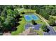 Aerial view of community tennis courts with green surroundings and a parking lot at 4032 Copper Creek Way, Buford, GA 30519