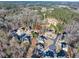 Neighborhood aerial view features lush trees surrounding homes in a quiet, well-maintained community at 1526 Rocky River Dr, Lawrenceville, GA 30045