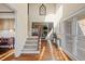 Inviting foyer with hardwood floors and an elegant staircase leading to the upper level at 1526 Rocky River Dr, Lawrenceville, GA 30045