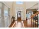 Grand foyer featuring a stained glass front door and hardwood floors at 1526 Rocky River Dr, Lawrenceville, GA 30045