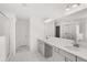 Modern bathroom with double vanity, quartz countertops and a glass enclosed shower at 1808 Lacebark Elm Way, Lawrenceville, GA 30045