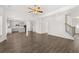 Open floor plan with hardwood floors connecting the living room to the kitchen at 1808 Lacebark Elm Way, Lawrenceville, GA 30045