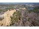 Overhead shot of community with sprawling land and beautiful lake views in the background at 202 Neely Rd, Fayetteville, GA 30214