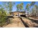 Exterior view of deck and back of home showing lots of wooded privacy at 202 Neely Rd, Fayetteville, GA 30214