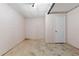 Unfinished basement with painted walls, concrete floor and utility access at 202 Neely Rd, Fayetteville, GA 30214