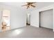 Bright bedroom with a ceiling fan, closet and an ensuite bath at 202 Neely Rd, Fayetteville, GA 30214