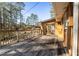 Outdoor deck with wood railing overlooking the wooded backyard at 202 Neely Rd, Fayetteville, GA 30214