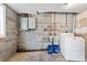 Basement laundry room with washer hookups and concrete block walls at 202 Neely Rd, Fayetteville, GA 30214