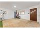 A view of a brightly-lit living room with wood walls, and natural light at 202 Neely Rd, Fayetteville, GA 30214