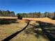 Expansive, grassy pasture land with a mix of trees and blue sky; ideal for recreational use at 202 Neely Rd, Fayetteville, GA 30214