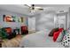 Well-lit bedroom with neutral walls, hardwood floors, and cozy decor at 185 Bob White Dr, Stockbridge, GA 30281