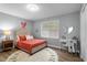 Cozy bedroom with neutral walls, a decorative rug, and modern furnishings at 185 Bob White Dr, Stockbridge, GA 30281