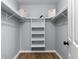 Walk-in closet features built-in shelving and ample storage space at 185 Bob White Dr, Stockbridge, GA 30281