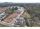 Aerial view of new community showing homes under construction and surrounding landscape at 1932 Appian Aly, Kennesaw, GA 30144