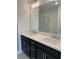 Bathroom vanity with double sinks, a large mirror, stylish light fixture, and subway tile shower visible at 1932 Appian Aly, Kennesaw, GA 30144