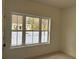 Bright room featuring a large window offering a neighborhood view and snow covered ground at 1932 Appian Aly, Kennesaw, GA 30144