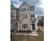 Attractive townhome with brick and siding exterior, complemented by gray shutters and a covered entrance at 1932 Appian Aly, Kennesaw, GA 30144