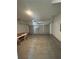 Spacious two-car garage with concrete floor and an automatic door at 1932 Appian Aly, Kennesaw, GA 30144