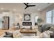 Cozy living room featuring an electric fireplace, modern decor, and open access to the kitchen at 1932 Appian Aly, Kennesaw, GA 30144