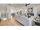 Inviting living room with a fireplace, neutral tones and an open floorplan to the kitchen at 1932 Appian Aly, Kennesaw, GA 30144