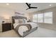 Inviting main bedroom with tufted headboard, soft lighting, and a ceiling fan at 1932 Appian Aly, Kennesaw, GA 30144