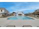 A stunning pool showcases a large, luxurious swimming area with lounge chairs, umbrellas, and a pool house at 1932 Appian Aly, Kennesaw, GA 30144