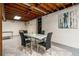 Finished basement space with an exposed ceiling and a dining table with seating for four at 2750 Old Horseshoe Bend Sw Rd, Marietta, GA 30064