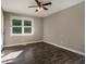 Bedroom with wood floor, ceiling fan, and a window with natural light at 2750 Old Horseshoe Bend Sw Rd, Marietta, GA 30064