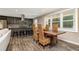 Open concept dining room featuring a wood table with seating adjacent to the kitchen at 2750 Old Horseshoe Bend Sw Rd, Marietta, GA 30064