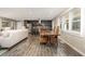 Open concept dining room featuring a wood table with seating adjacent to the living room and kitchen at 2750 Old Horseshoe Bend Sw Rd, Marietta, GA 30064