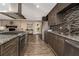 Modern kitchen featuring granite countertops and stainless steel appliances, with a view into the living area at 2750 Old Horseshoe Bend Sw Rd, Marietta, GA 30064