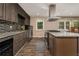 Modern kitchen featuring granite countertops, stainless steel appliances and sleek backsplash at 2750 Old Horseshoe Bend Sw Rd, Marietta, GA 30064