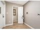 Mud room with tile floor, adjacent laundry room, and access to the exterior of the house at 2750 Old Horseshoe Bend Sw Rd, Marietta, GA 30064