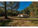 Secluded property showcasing a charming single-Gathering home nestled among mature trees at 2750 Old Horseshoe Bend Sw Rd, Marietta, GA 30064