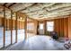 Unfinished basement featuring insulation, cement flooring, and a walkout door at 3455 Dalwood Dr, Suwanee, GA 30024