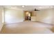 Large bonus room with neutral carpet, recessed lights and staircase access at 3455 Dalwood Dr, Suwanee, GA 30024