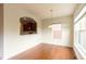 Bright dining area with hardwood floors and view into kitchen at 3455 Dalwood Dr, Suwanee, GA 30024