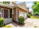 Beautiful home exterior with stone accents, a brown front door, and a well-maintained lawn at 3455 Dalwood Dr, Suwanee, GA 30024