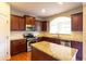 Updated kitchen with island, stainless steel appliances, and granite countertops at 3455 Dalwood Dr, Suwanee, GA 30024