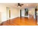 Spacious living room features hardwood floors, ceiling fan and an open floor plan at 3455 Dalwood Dr, Suwanee, GA 30024