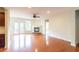 Bright living room featuring hardwood floors, a fireplace, and access to an outdoor deck at 3455 Dalwood Dr, Suwanee, GA 30024