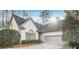 Charming home featuring manicured landscaping and a two-car garage at 3923 Ashford Ne Trl, Brookhaven, GA 30319