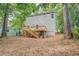 Backyard featuring a wooden deck with staircase, and plenty of tree coverage at 577 Center Hill Nw Ave, Atlanta, GA 30318