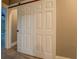 This bedroom features a sliding, white barn door with six panels at 577 Center Hill Nw Ave, Atlanta, GA 30318